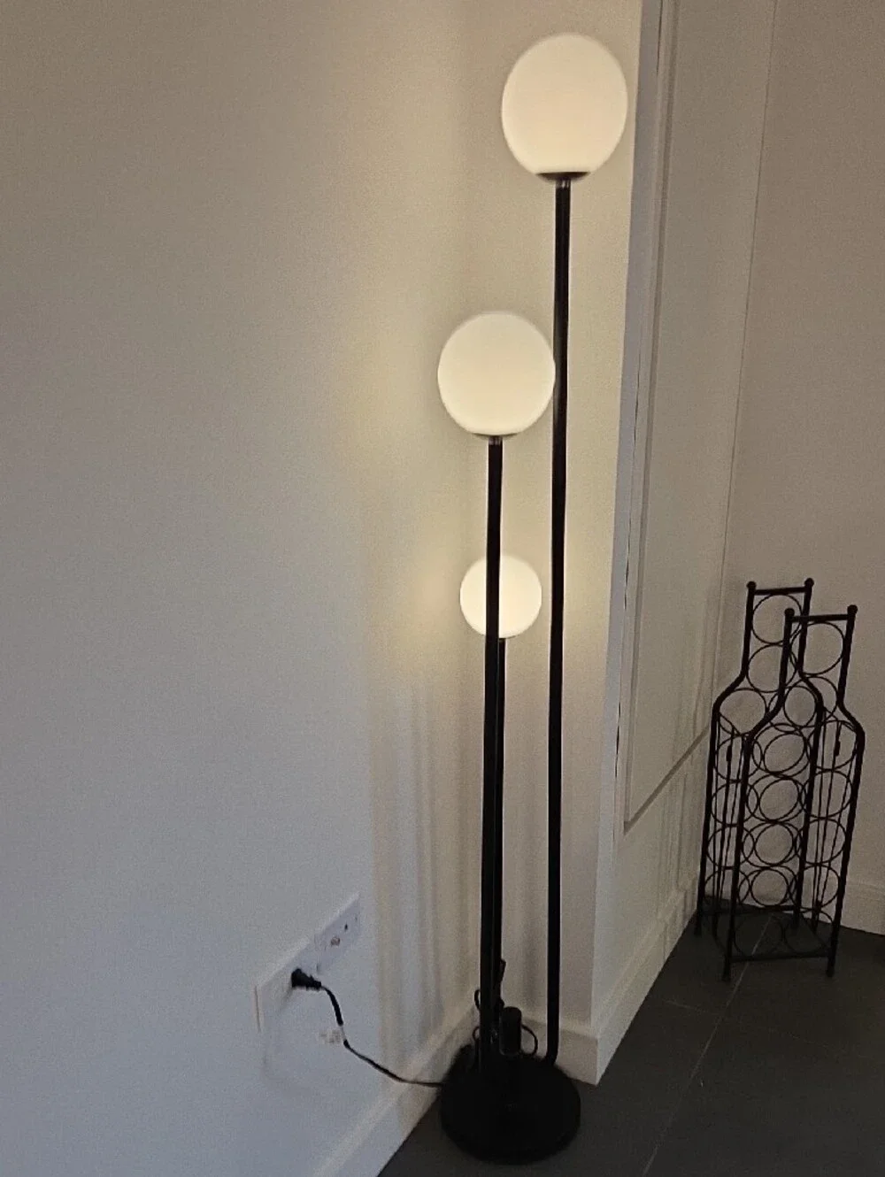 Black Triple-Globe Floor Lamp with White Glass Shades